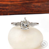 Pear Moissanite engagement ring with leaf engravings