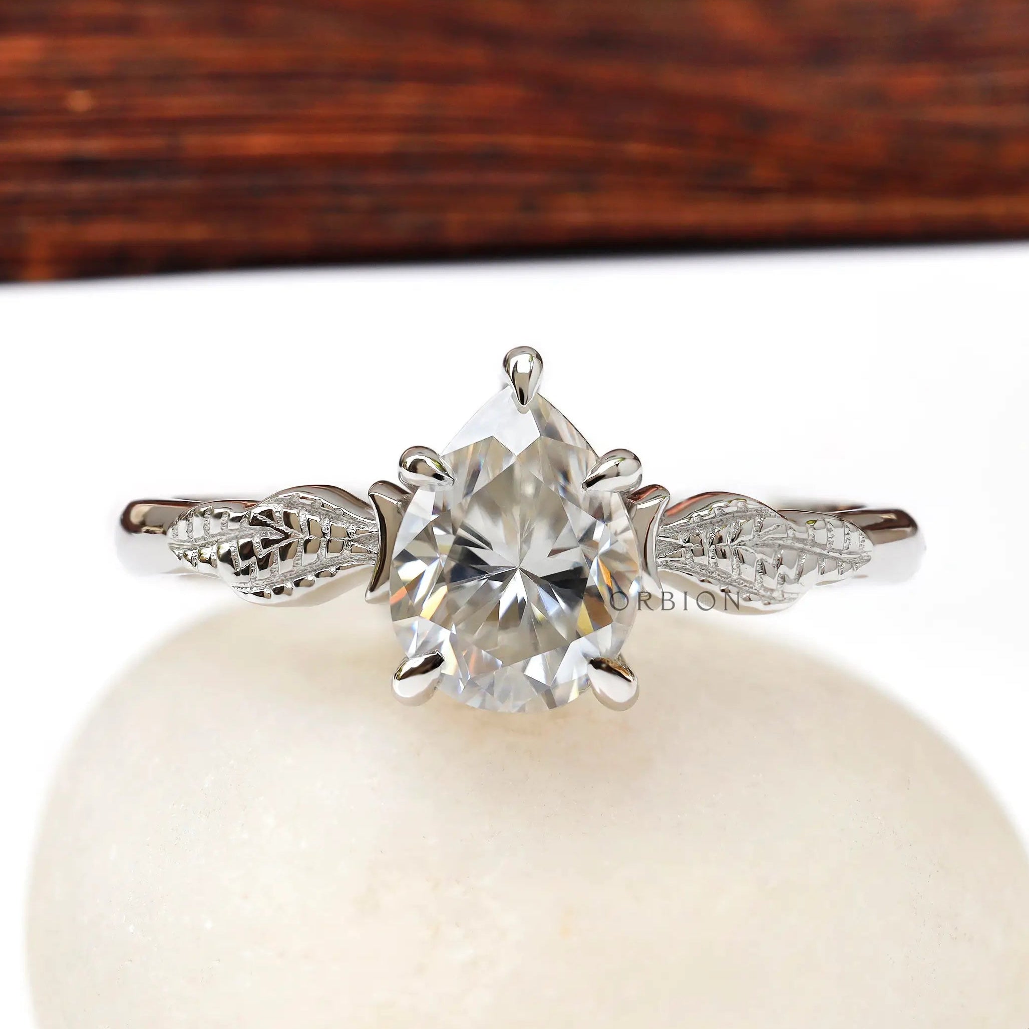 Pear Moissanite engagement ring with leaf engravings
