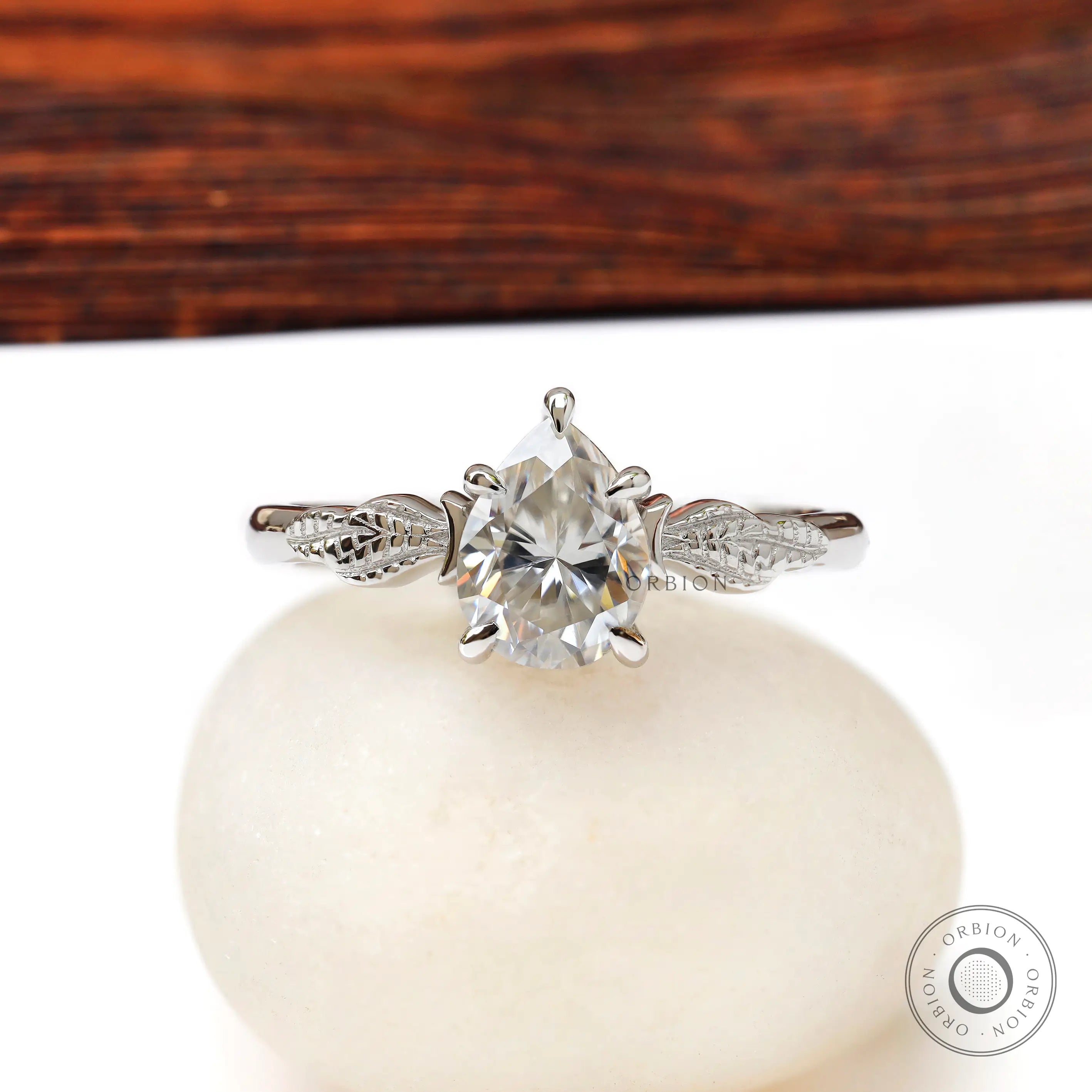 Pear Moissanite engagement ring with leaf engravings