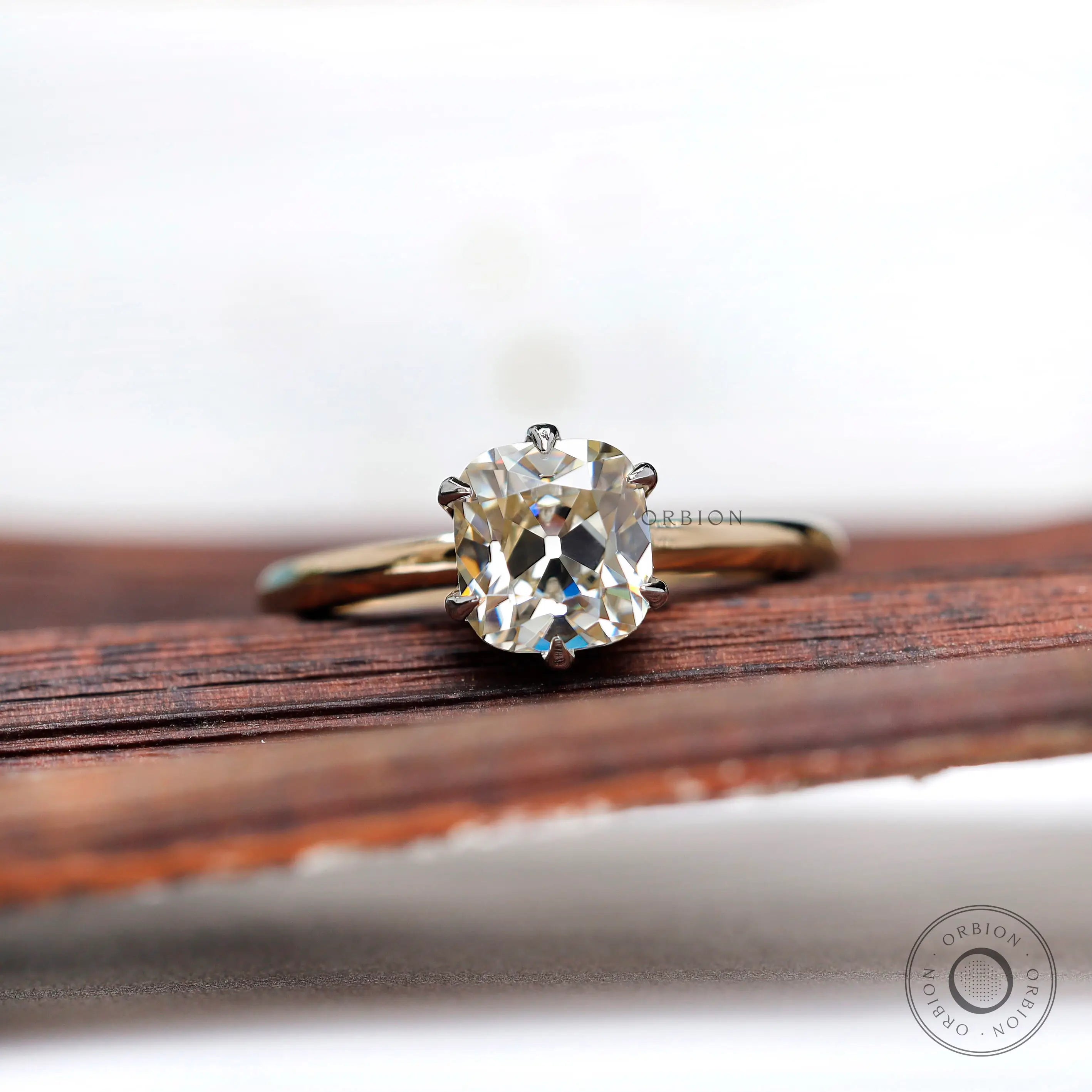 Front view of OMC elongated cushion moissanite two tone ring