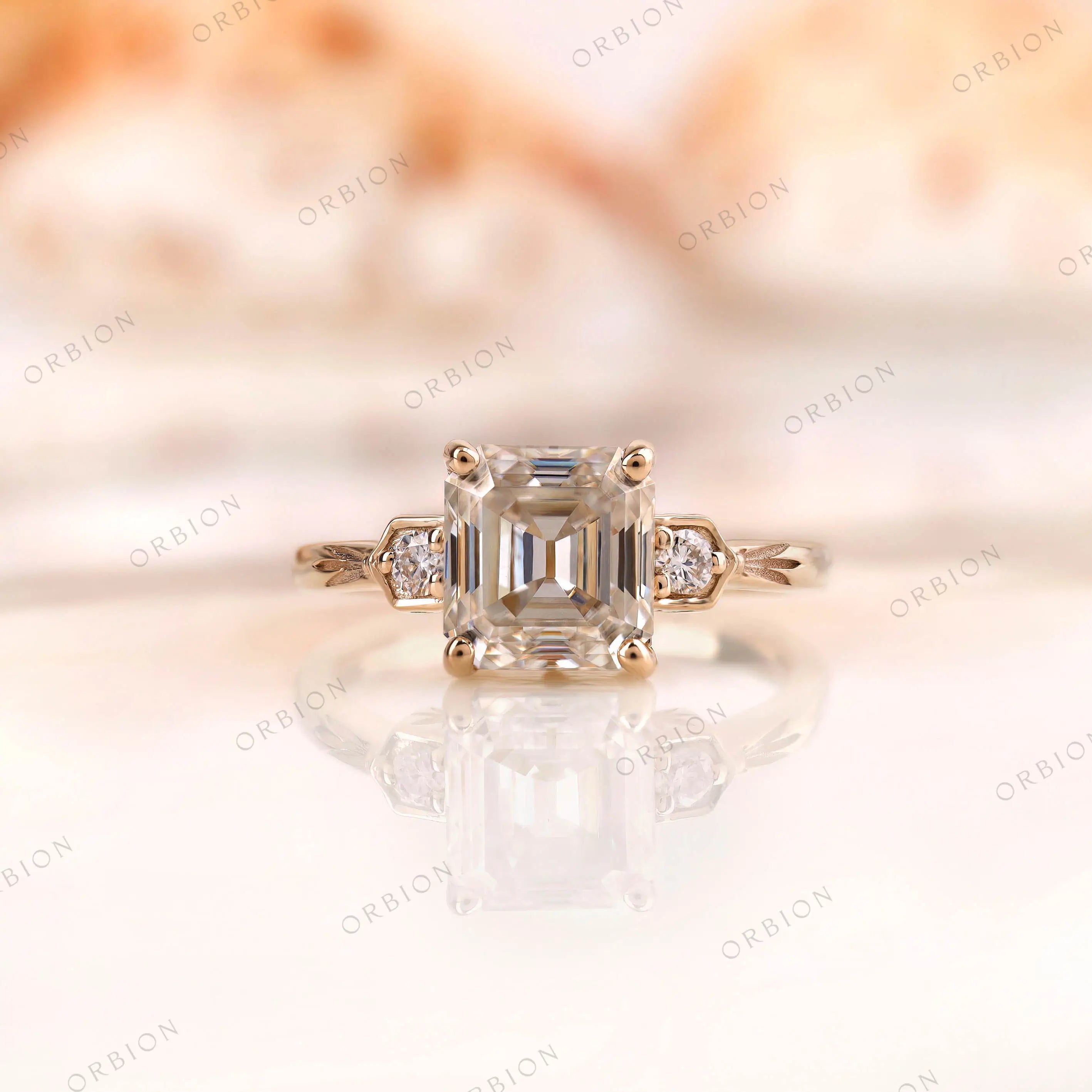Floral engraved three stone asscher cut moissanite ring in gold