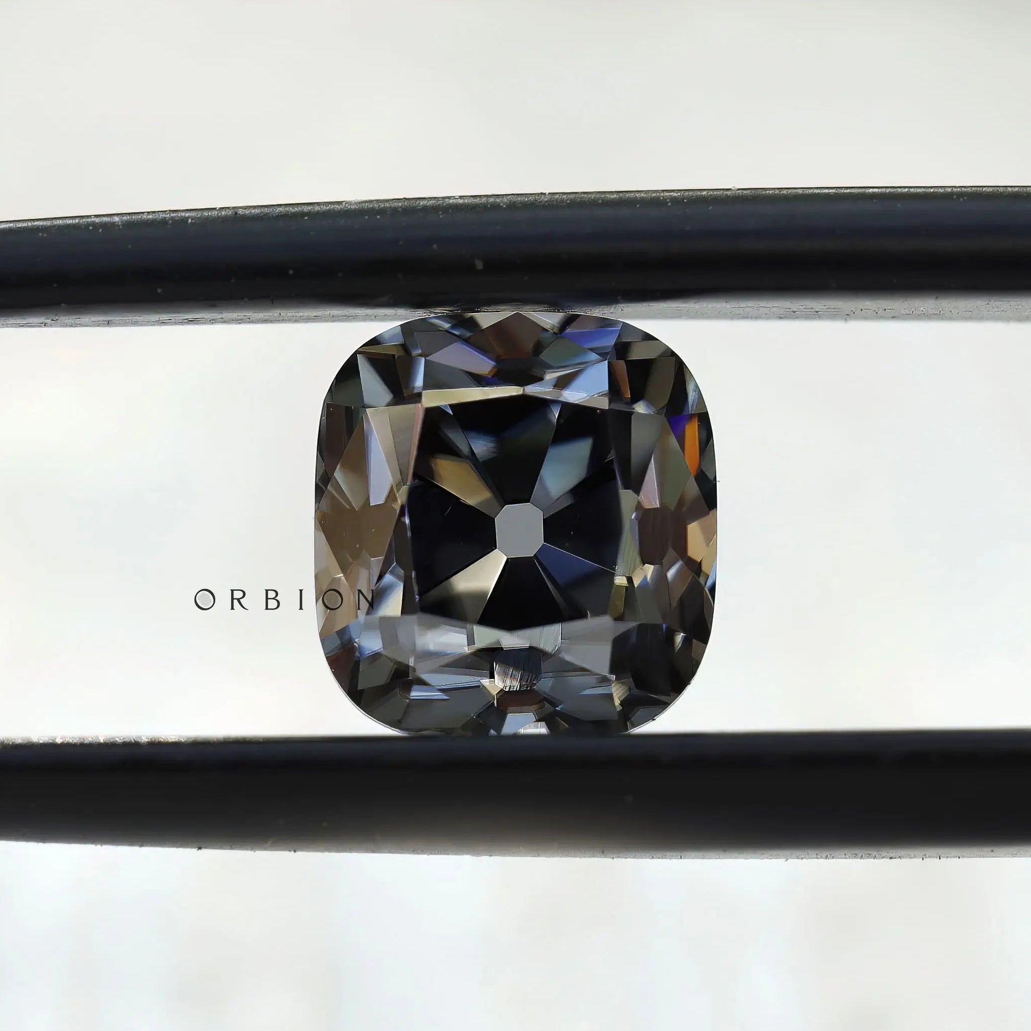 1.7 CT Old Mine Cut Cushion Grey Loose Moissanite in Tweezers