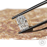 Radiant brilliant cut loose lab diamond in black tweezers