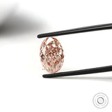 Close view of intense pink oval diamond with crisp faceting