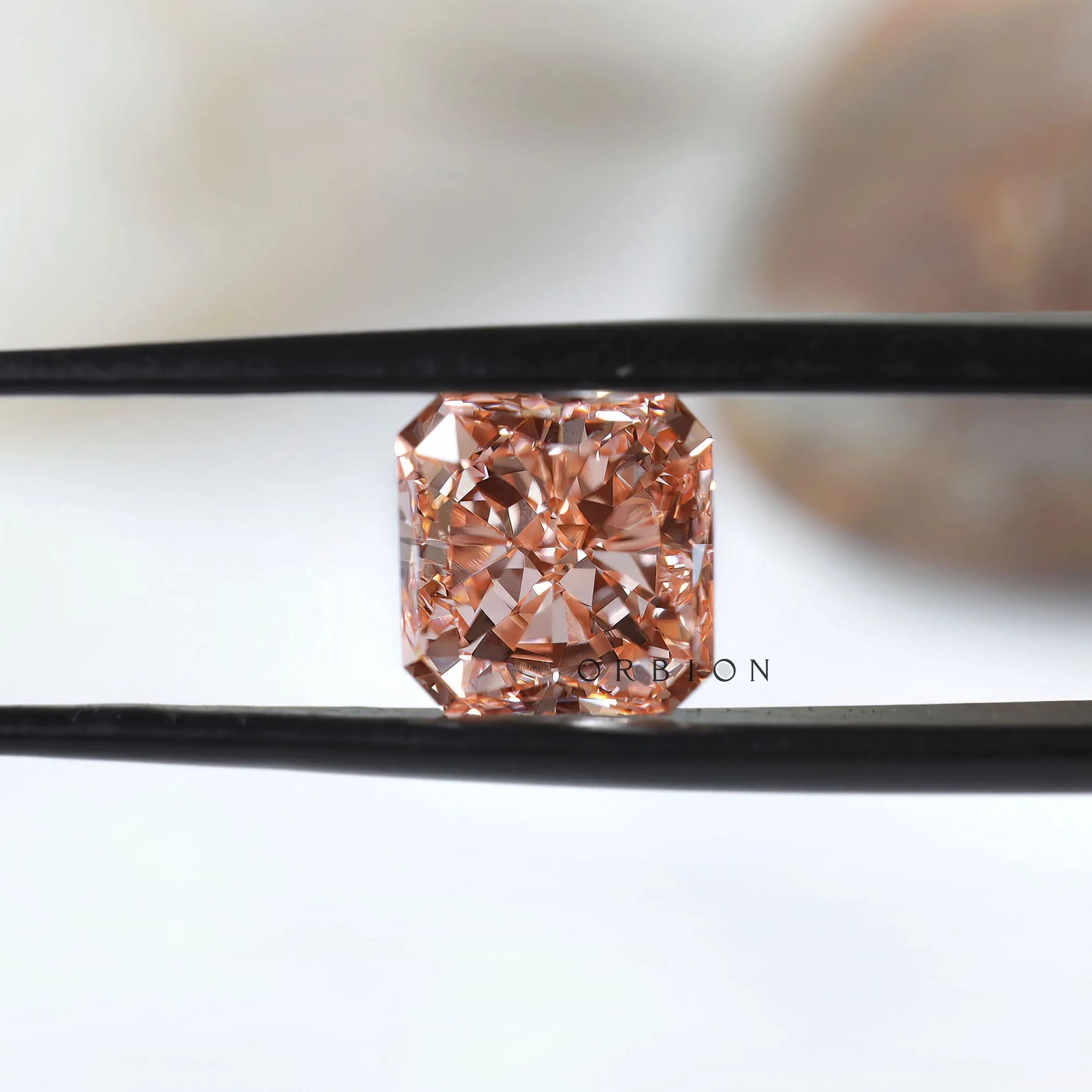 Front view of vivid pink radiant brilliant loose diamond