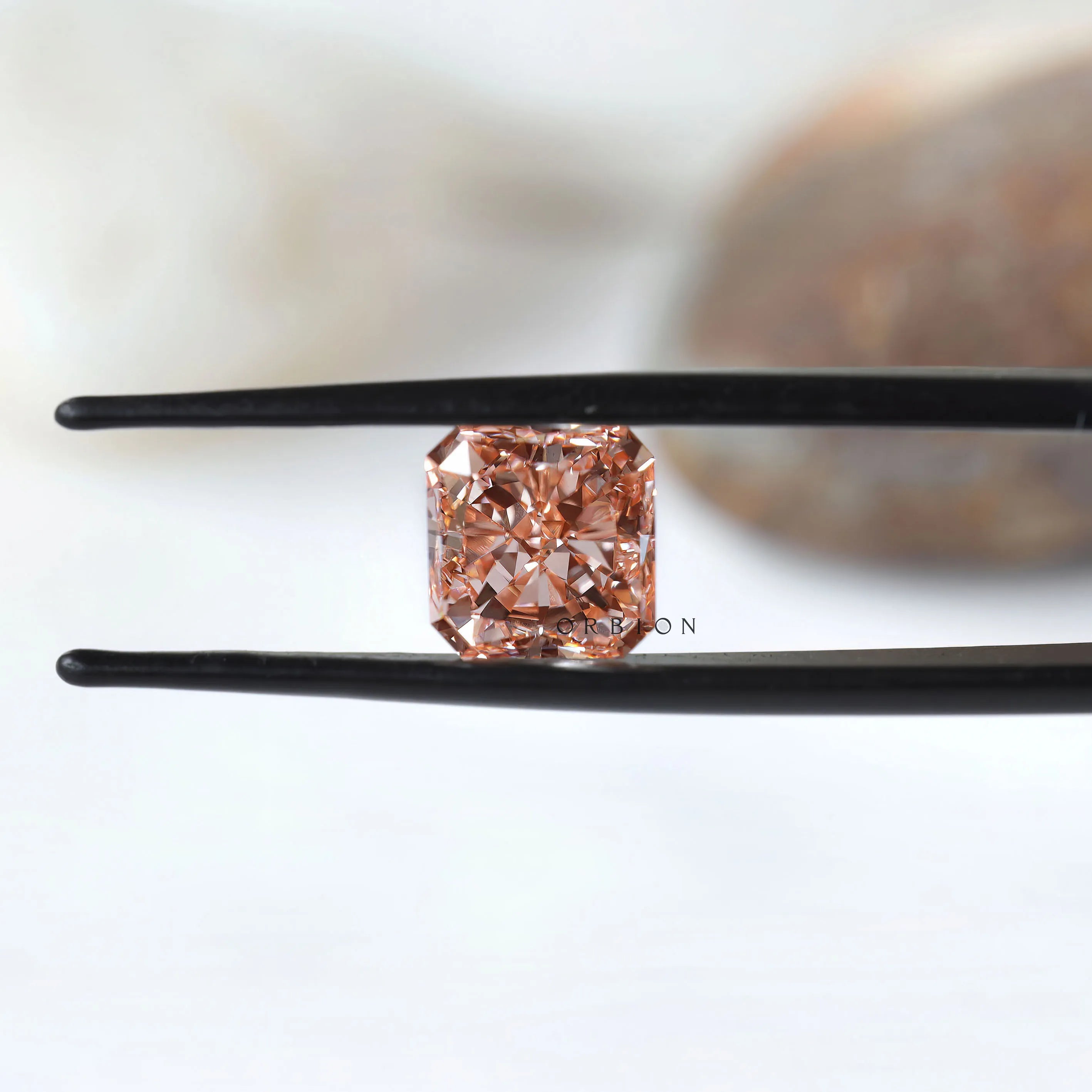 Front view of vivid pink radiant brilliant loose diamond