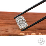 Elongated cushion crushed ice lab diamond held in black tweezers