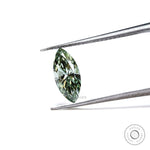 Fancy vivid green marquise lab diamond held in tweezers