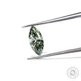 Fancy vivid green marquise lab diamond held in tweezers