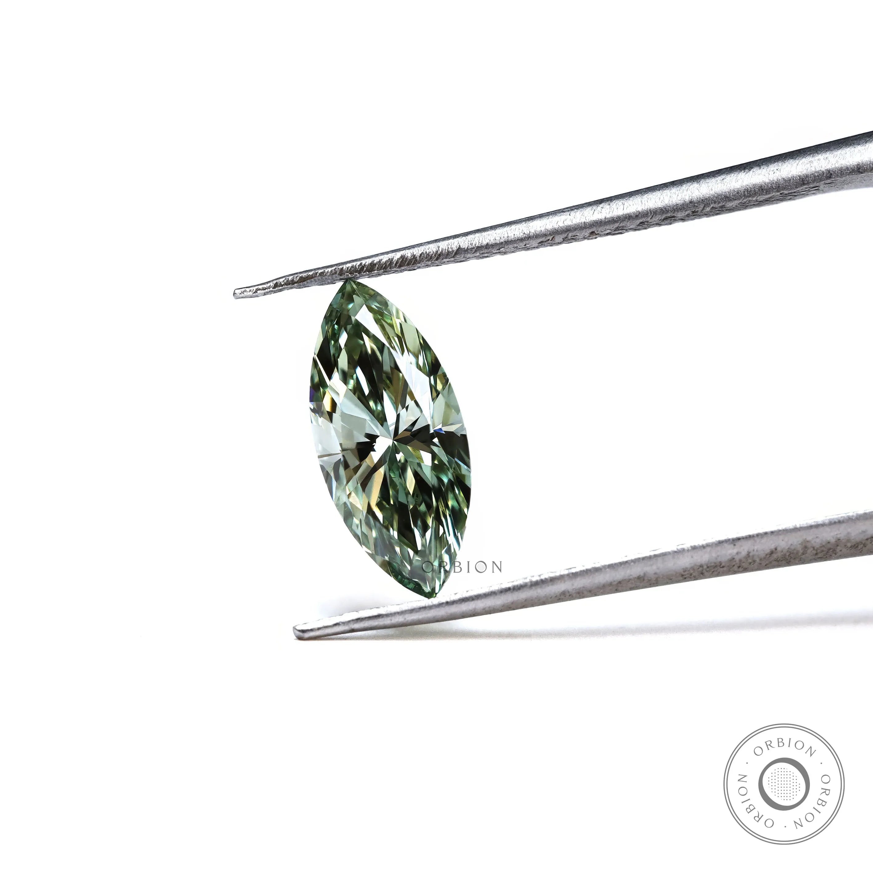 Fancy vivid green marquise lab diamond held in tweezers