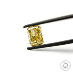 Fancy intense yellow radiant cut lab diamond in tweezers