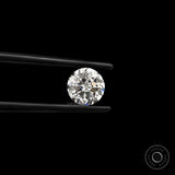 Round nova cut loose lab diamond held in black tweezers on black background