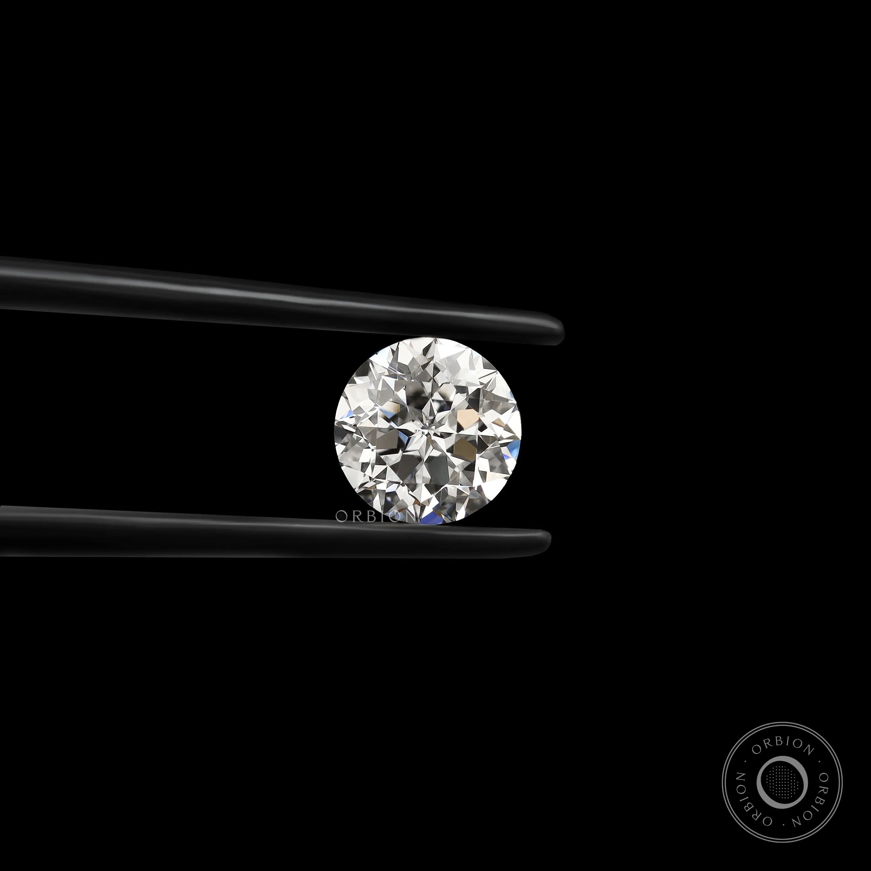 Round nova cut loose lab diamond held in black tweezers on black background