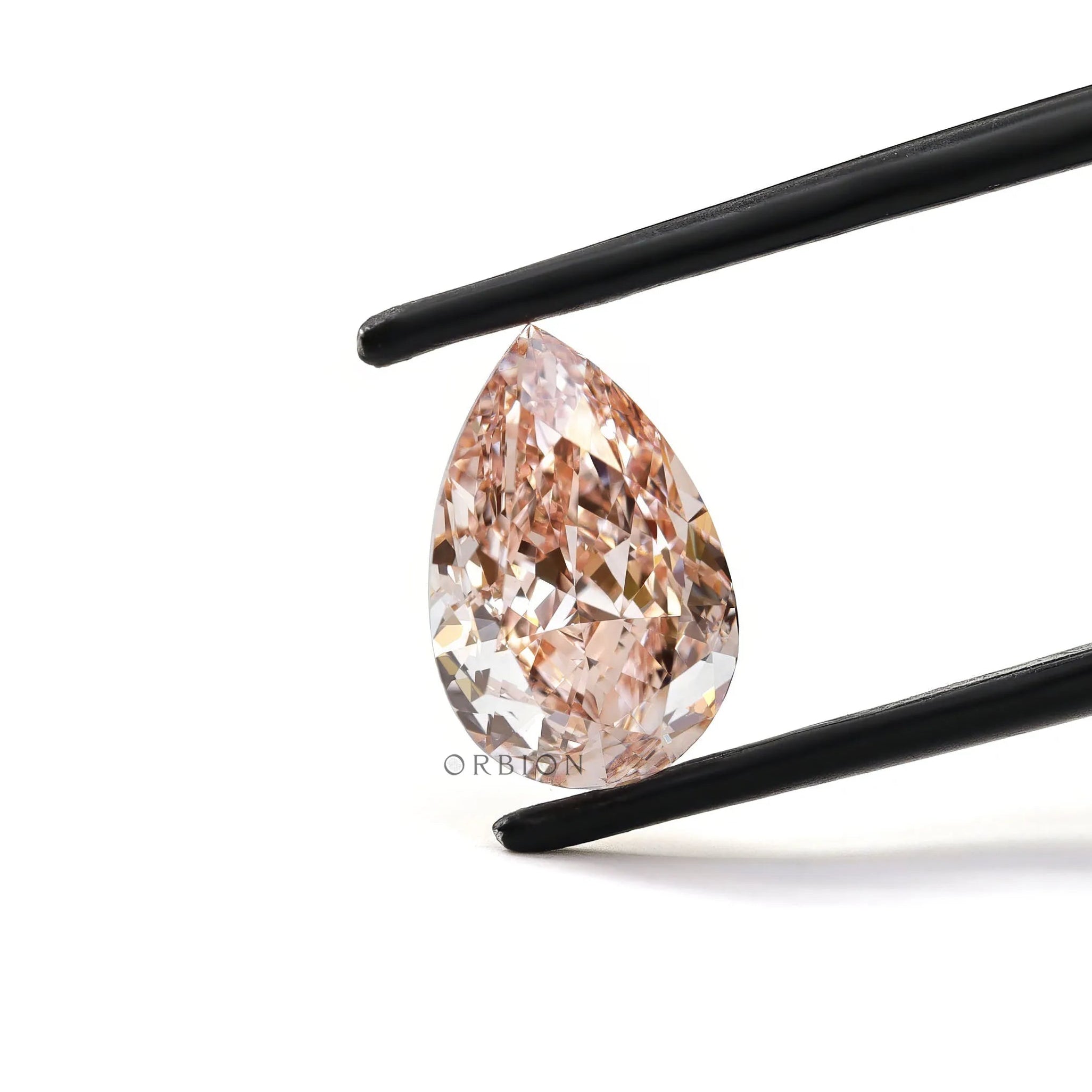 Fancy vivid pink pear lab diamond held in tweezers