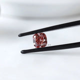 Fancy deep purplish pink cushion lab diamond in tweezers