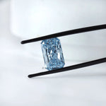 Angled view of radiant brilliant cut blue lab diamond