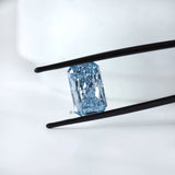 Angled view of radiant brilliant cut blue lab diamond