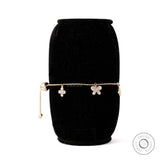 Angled view lab diamond butterfly and clover charm bolo bracelet