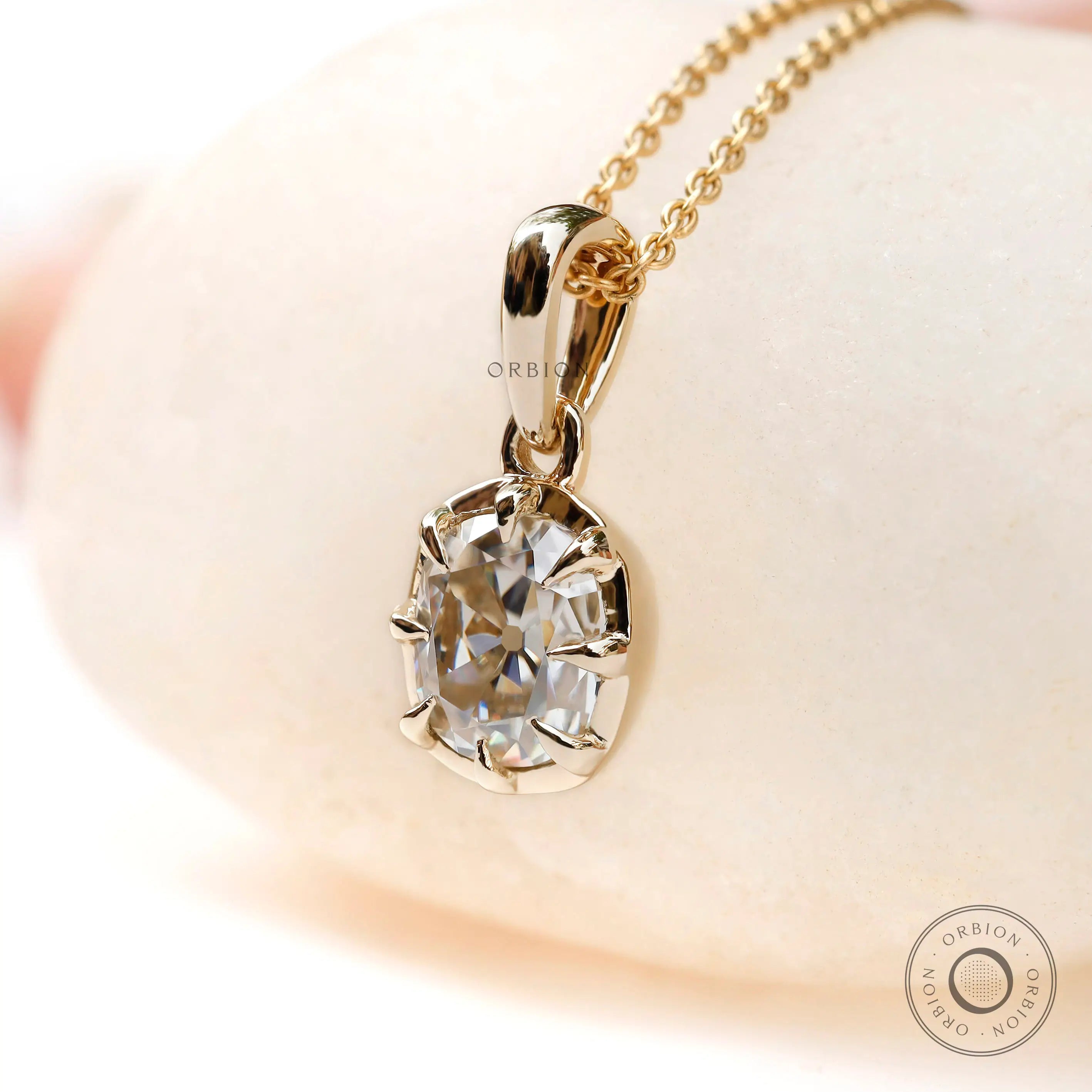 Angled view cushion old mine moissanite pendant yellow gold