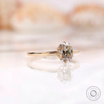 Angled front view of tulip set elongated cushion moissanite ring