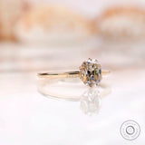 Angled front view of tulip set elongated cushion moissanite ring