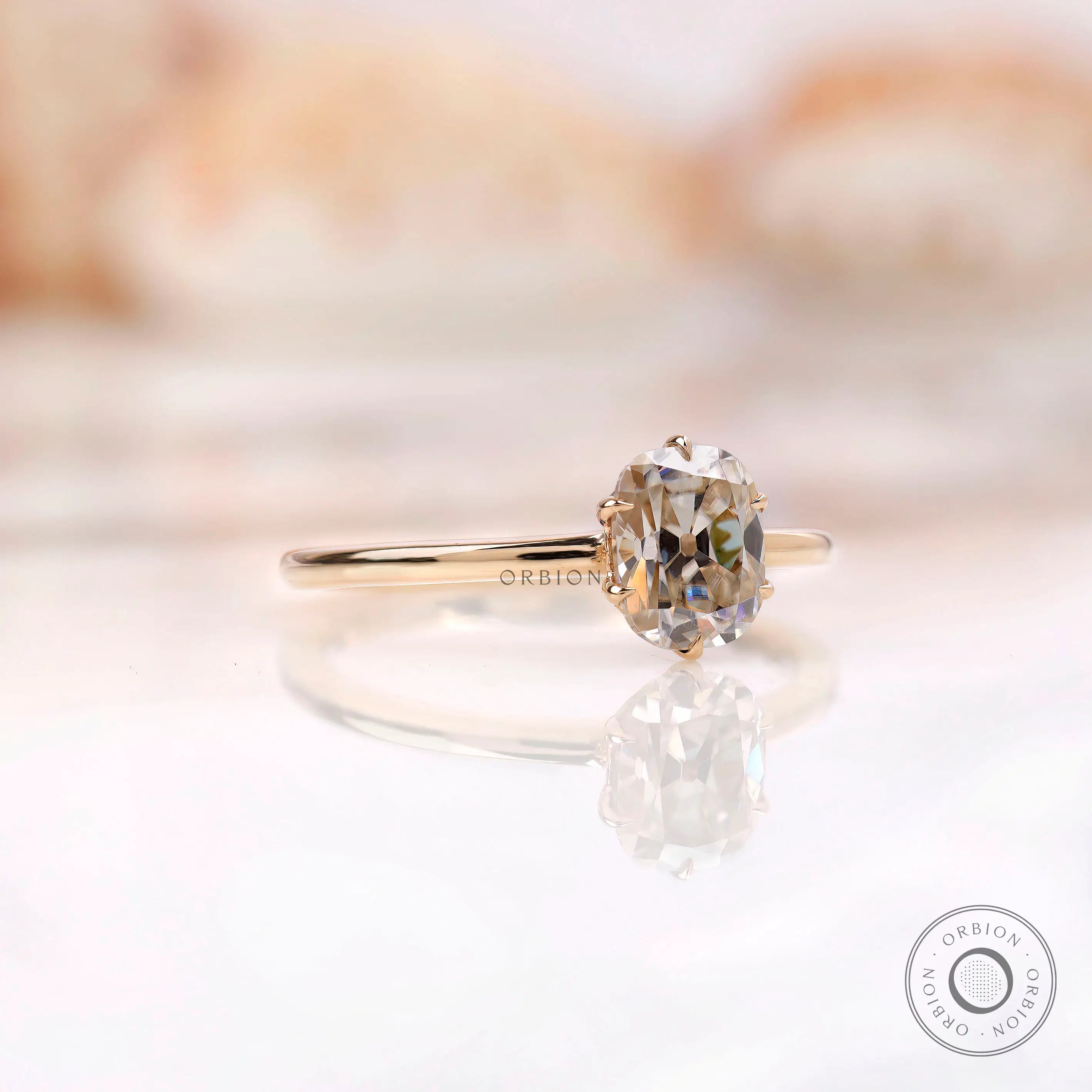 Angled front view of tulip set elongated cushion moissanite ring