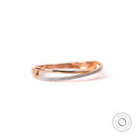 Angled view diamond crossover bangle bracelet in rose gold