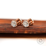 Angled front view rose gold moissanite stud earrings