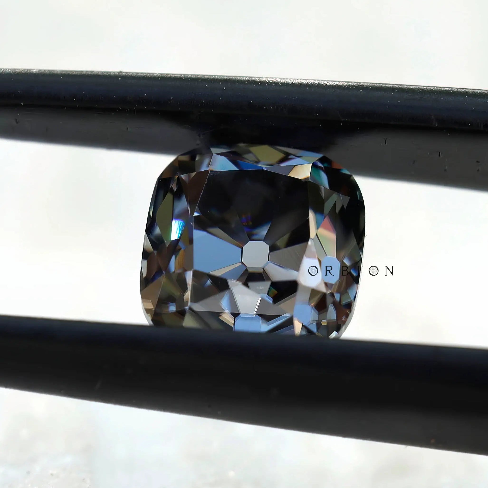 Close-up of 1.7 CT Old Mine Cut Cushion Grey Moissanite Stone