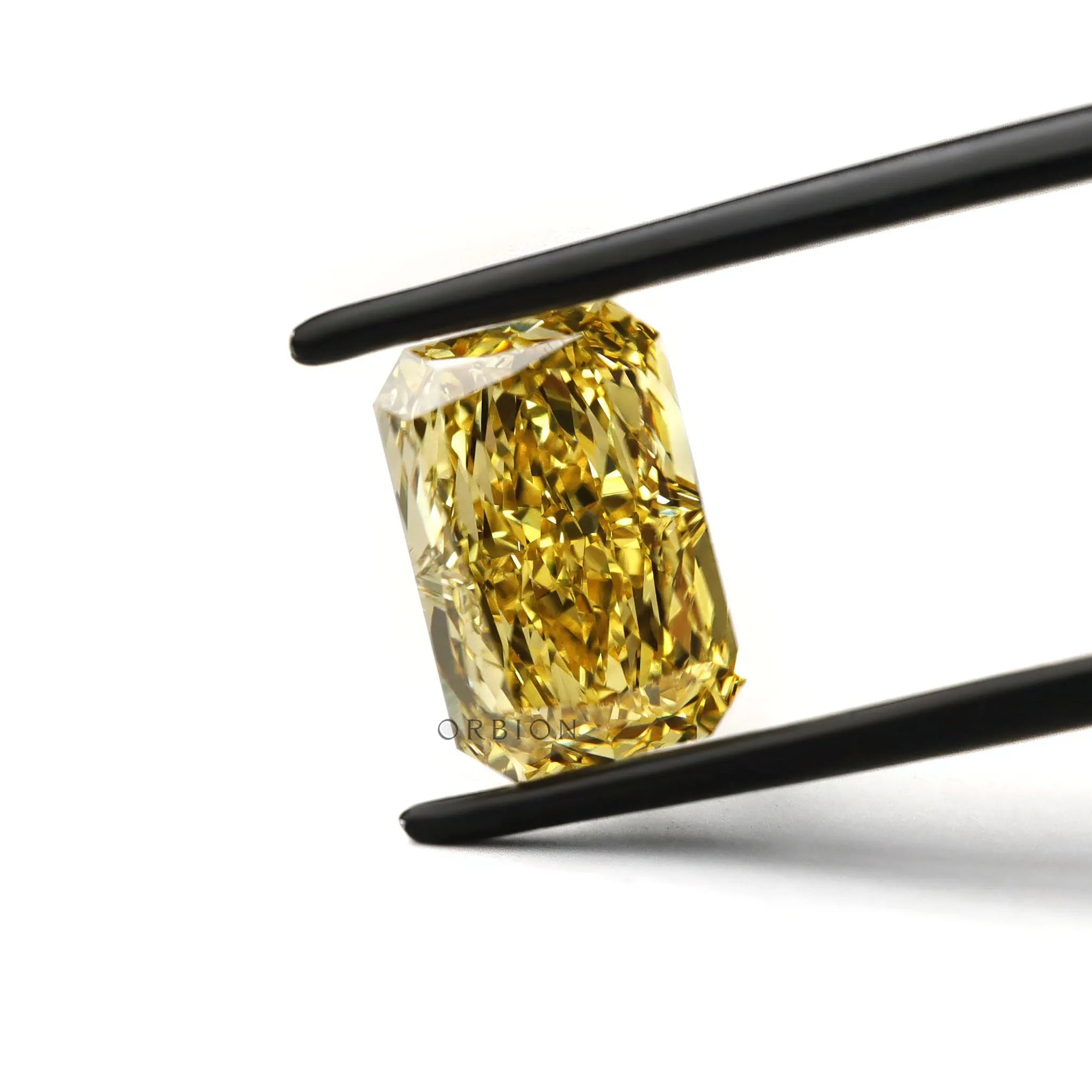 Loose radiant yellow lab diamond angled close up