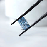 Angled view radiant blue loose lab diamond in tweezers