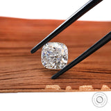 Square cushion loose moissanite in black tweezers close-up