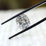 Loose cushion moissanite showing antique facet reflections