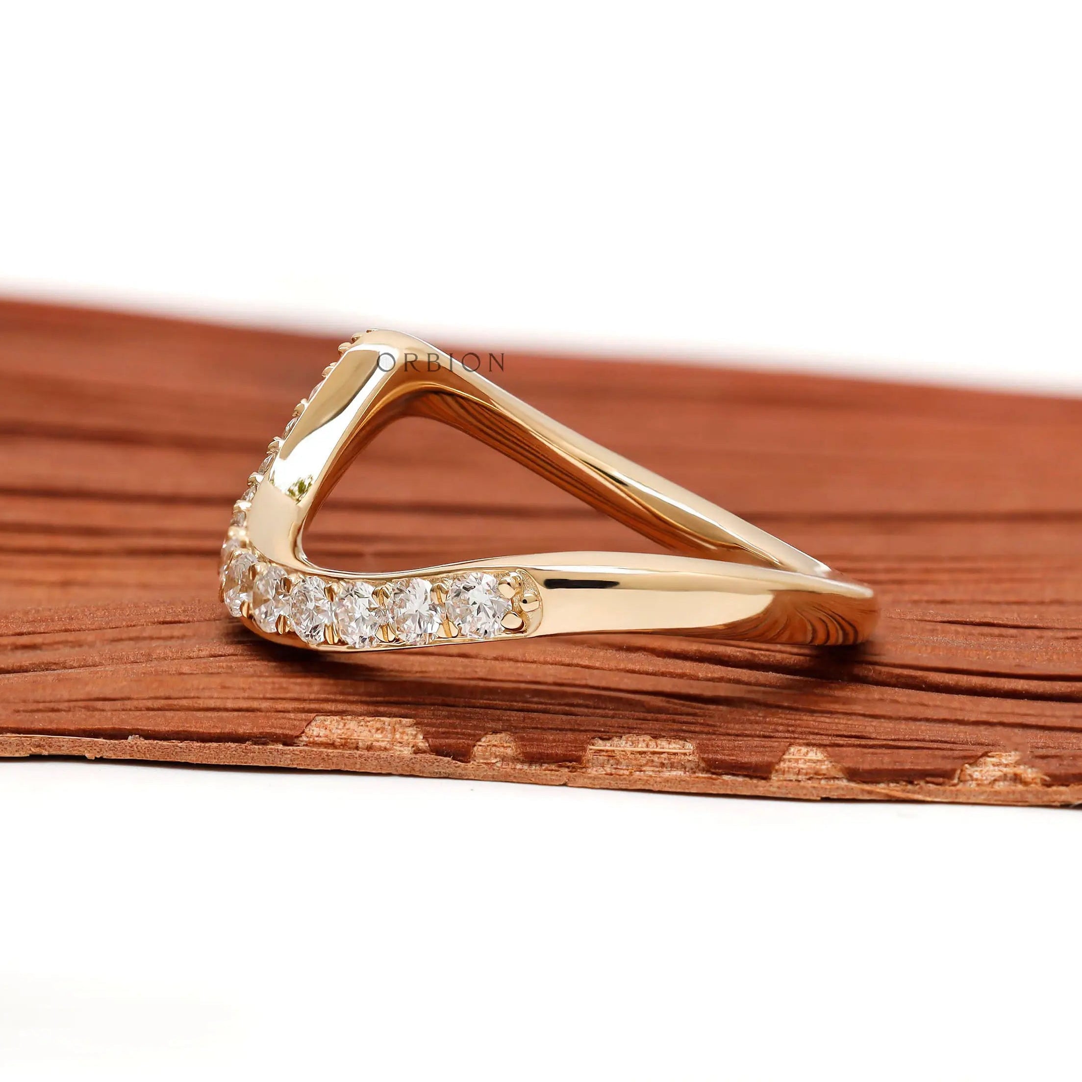 Elegant diamond wave-style band in 10K yellow gold