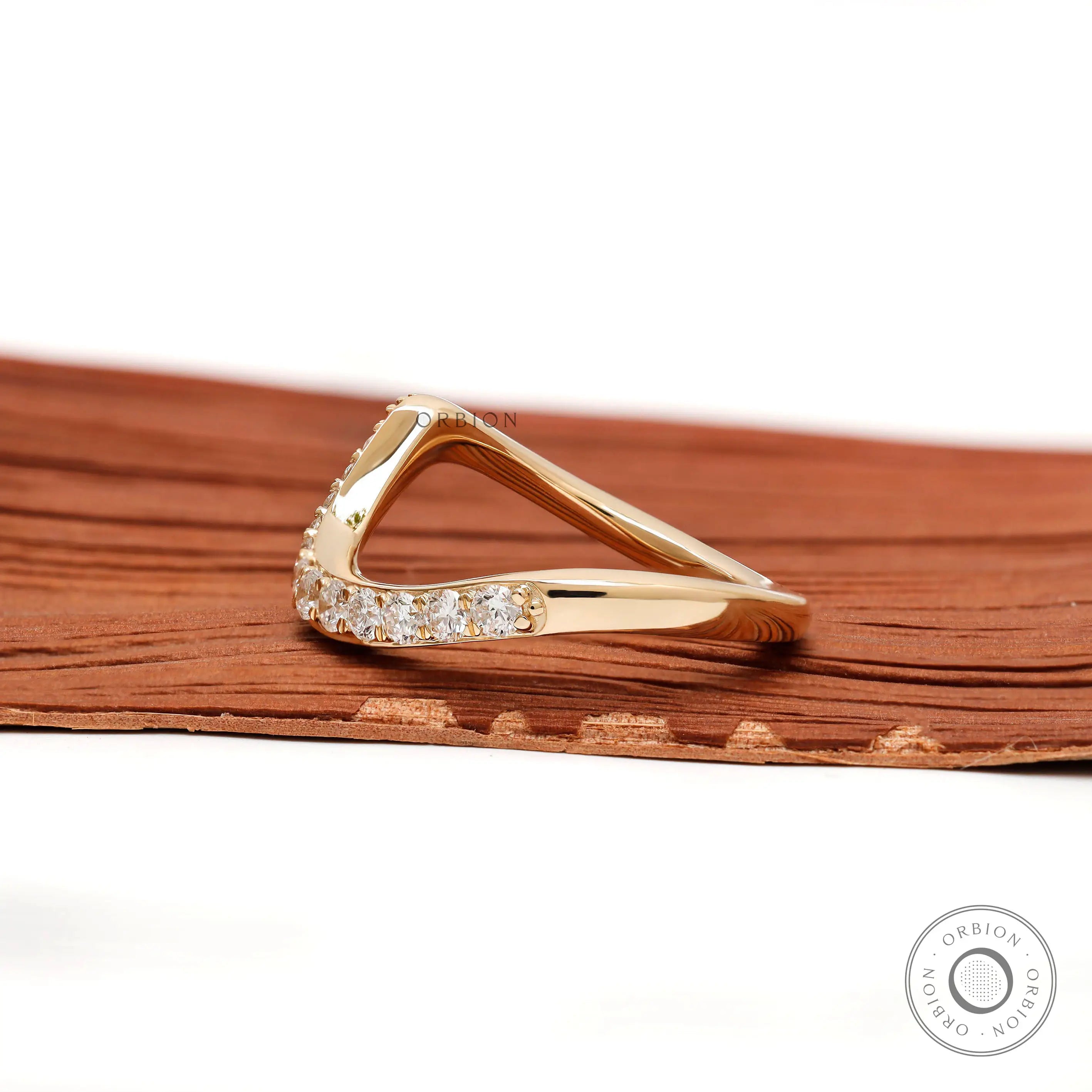 Elegant diamond wave-style band in 10K yellow gold