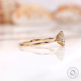 Side profile of tulip setting moissanite ring in yellow gold
