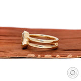 Side profile double shank bezel champagne moissanite ring yellow gold