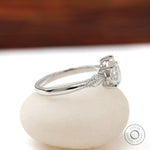 Siide angle of the white gold engagement ring with leaf detailing