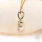 Side profile Georgian bezel moissanite pendant yellow gold