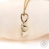 Side profile Georgian bezel moissanite pendant yellow gold