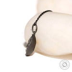 Side profile of Georgian style pear moissanite pendant