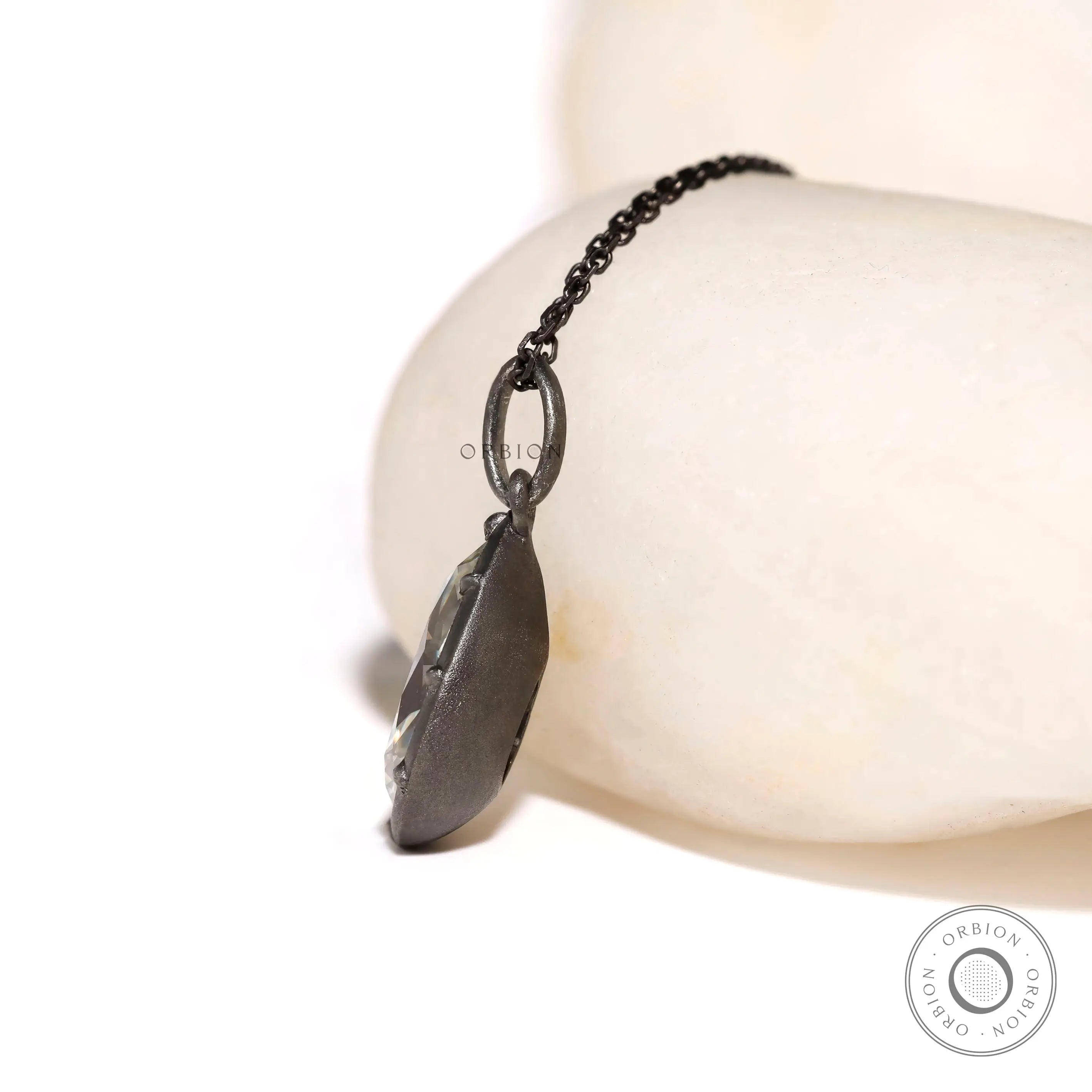 Side profile of Georgian style pear moissanite pendant