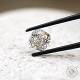 Angled cushion brilliant cut moissanite on light stone background