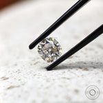 Angled view elongated cushion old mine cut loose moissanite