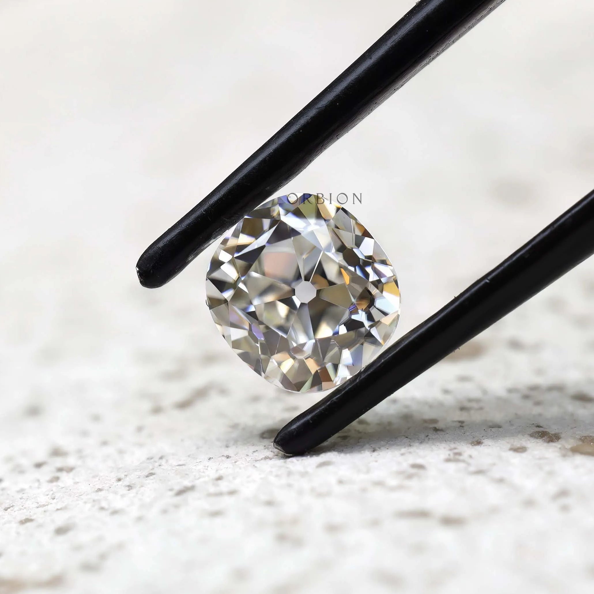 Angled view elongated cushion old mine cut loose moissanite
