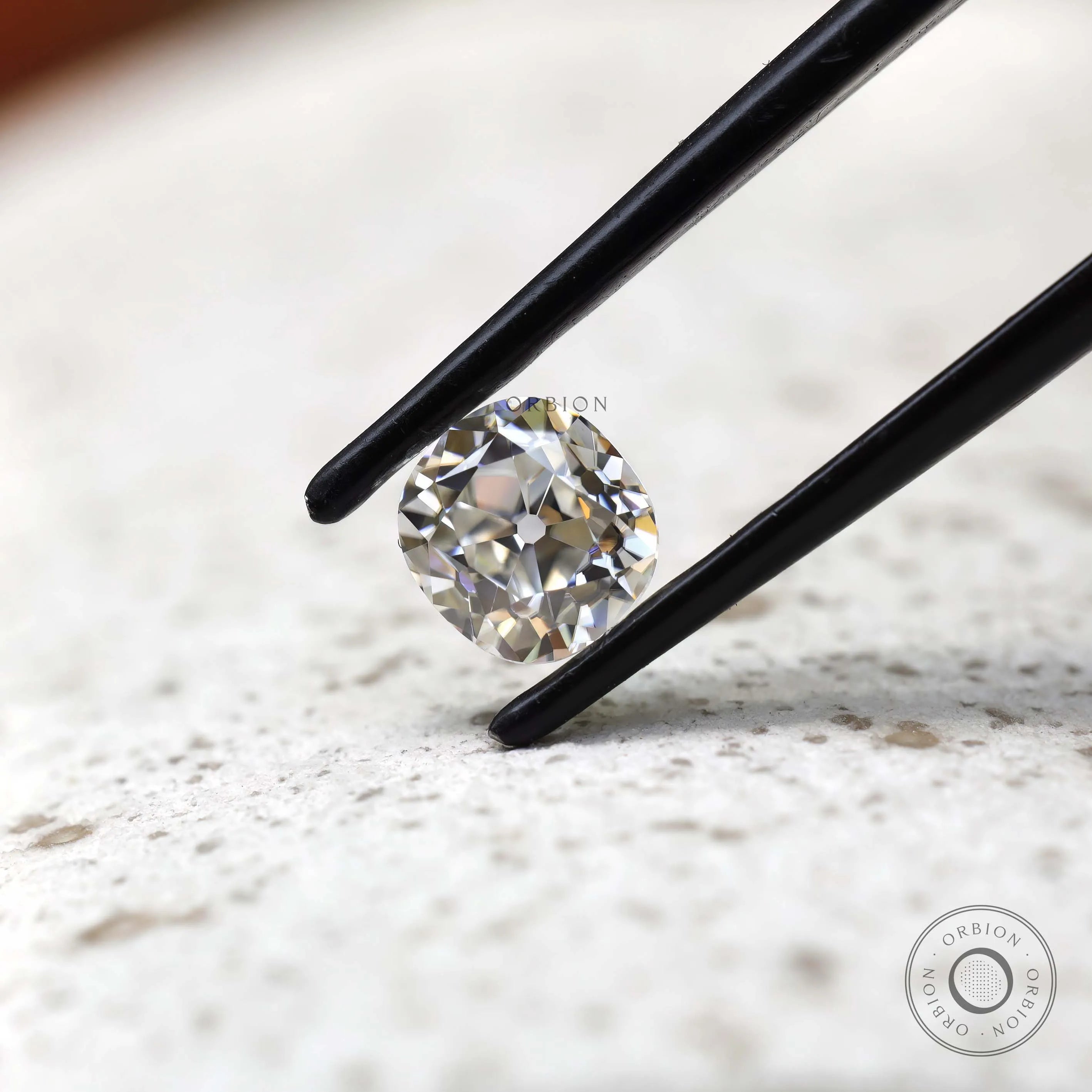 Angled view elongated cushion old mine cut loose moissanite
