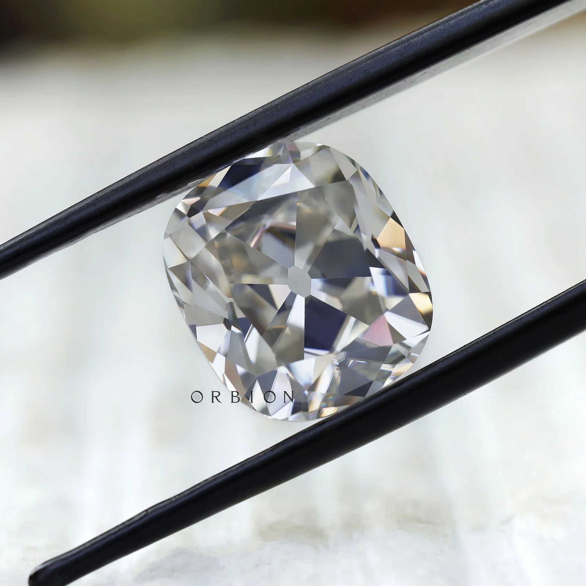 DEF cushion moissanite with soft old mine sparkle