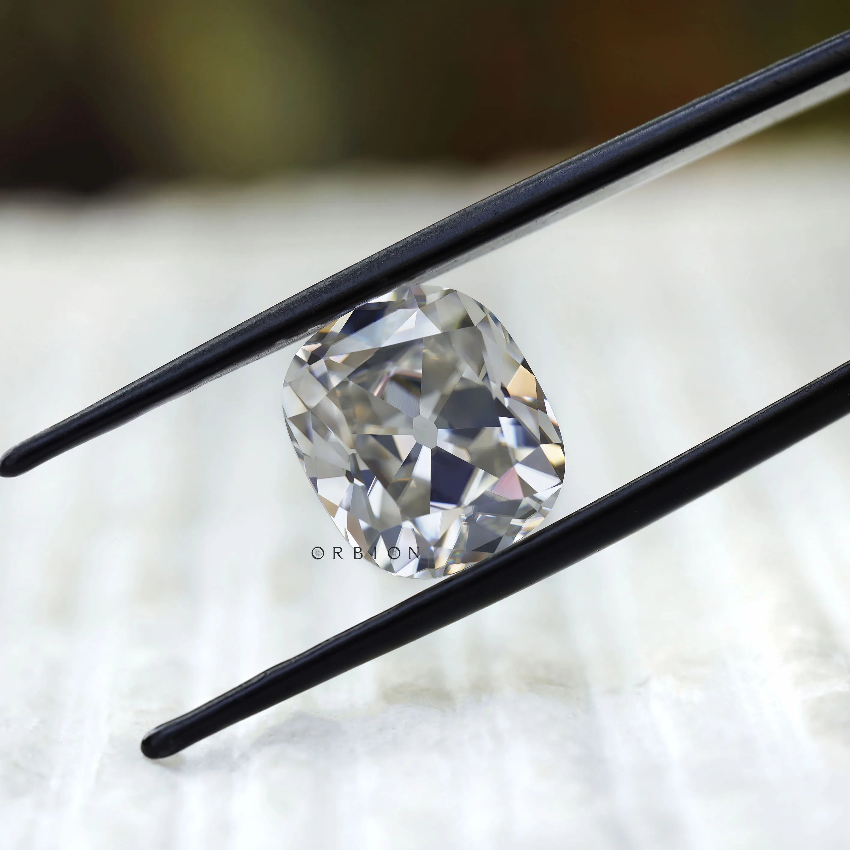 DEF cushion moissanite with soft old mine sparkle