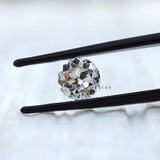 Vintage round moissanite with large facets in close view