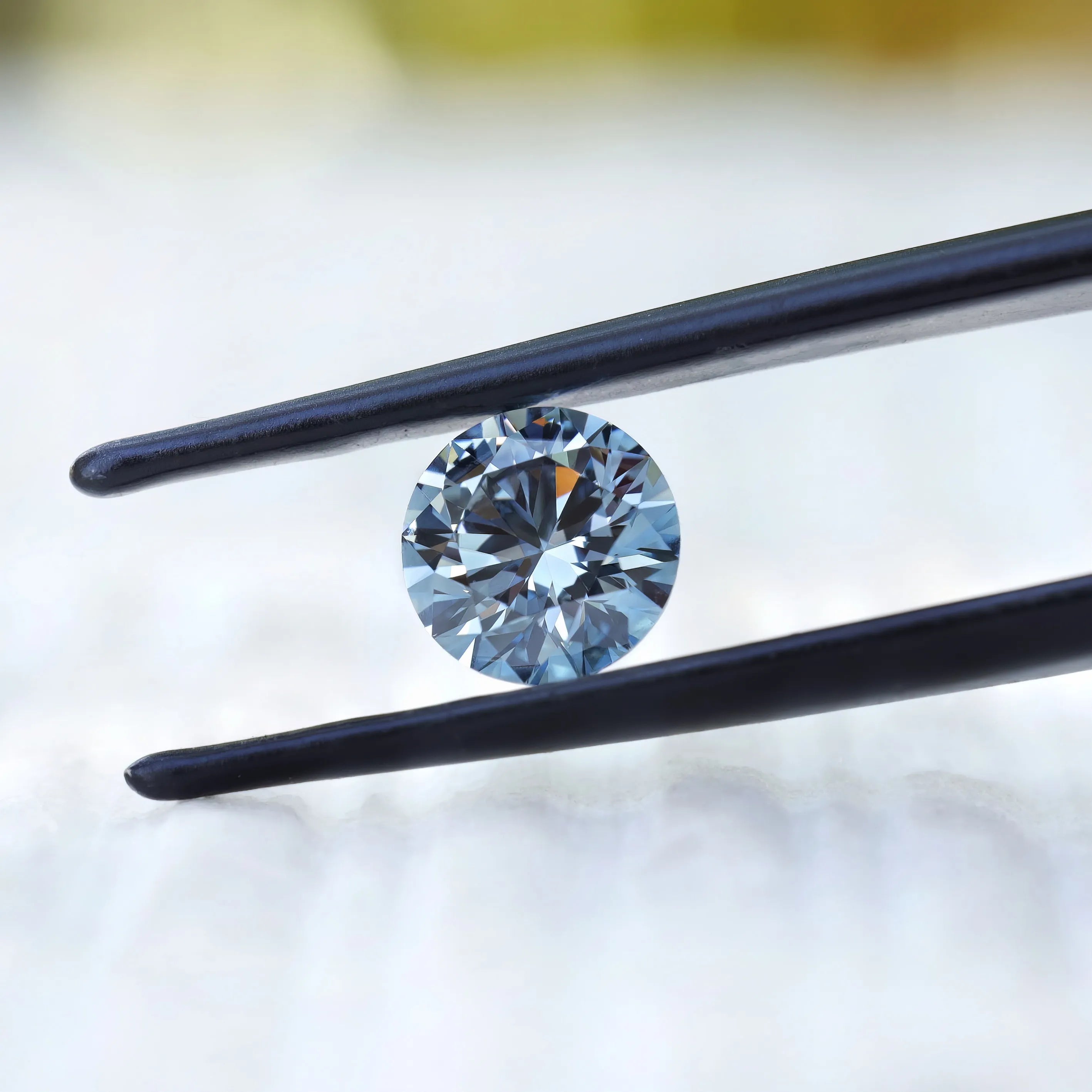 Side tilted view of fancy intense blue round diamond